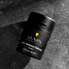 Lumin Anti-Redness Defense cream for men, 1.01 fl oz black skincare bottle on gray textured surface