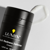 Lumin Anti-Redness Defense cream for men with smooth white moisturizer swatch on white background