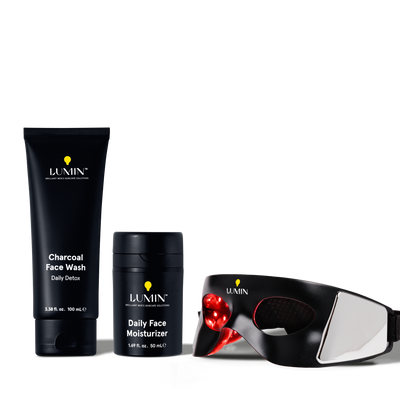 Lumin men's skincare set with charcoal face wash, daily face moisturizer, and LED light therapy mask for detox and hydration.