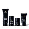Lumin men's skincare set with Charcoal Face Wash, Daily Face Moisturizer, Dark Circle Defense Balm, and Charcoal Scrub.
