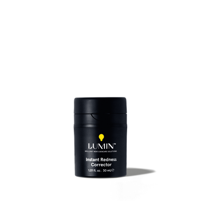 Lumin Instant Redness Corrector skincare product for men, 1.01 fl. oz. black travel-size container with yellow logo.