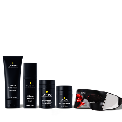 Lumin men's skincare set with charcoal face wash, wrinkle defense serum, daily moisturizer, dark circle balm, and LED eye mask.